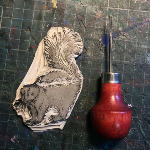 Tiny Lino block and u gauge on cutting mat with centimetre grid